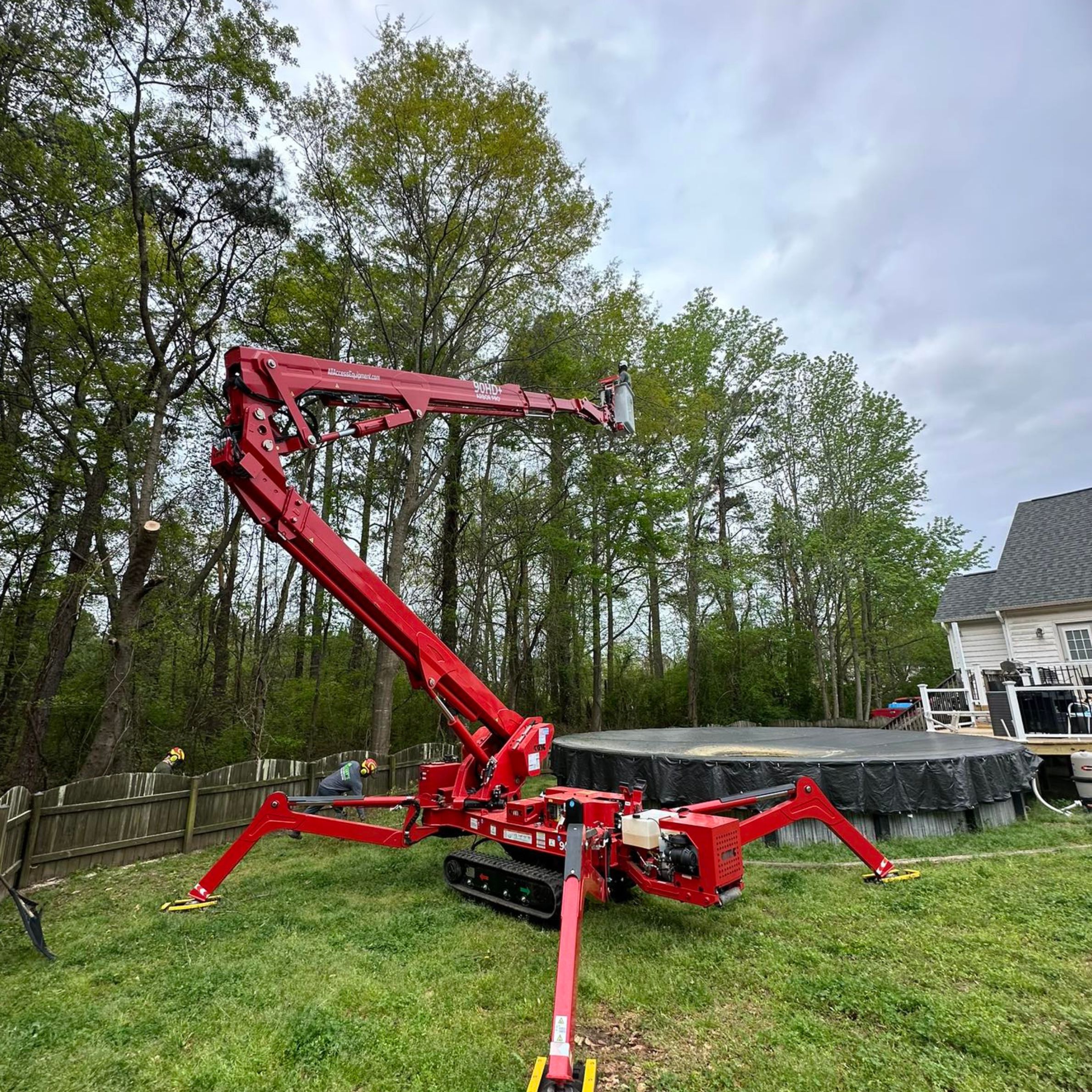 90 foot red track spider lift yard access by pool